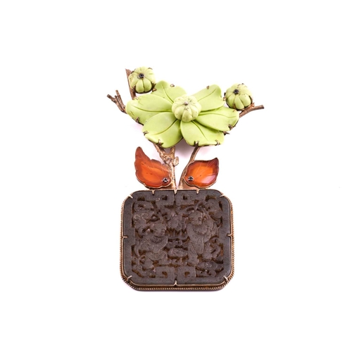 114 - A large Chinese brooch and two Chinese carved jade pendants; The brooch has a carved jade panel of t... 