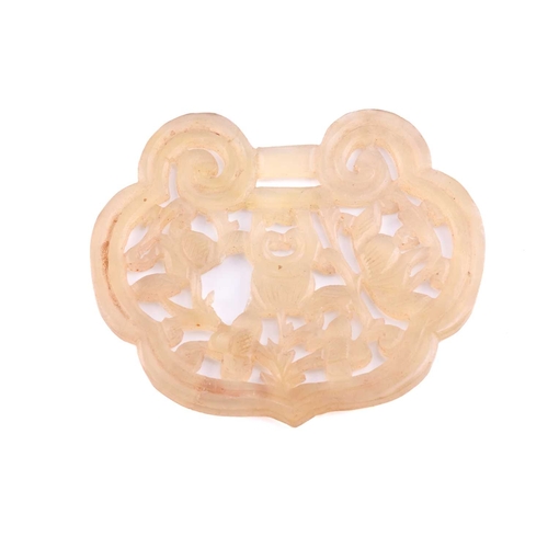 114 - A large Chinese brooch and two Chinese carved jade pendants; The brooch has a carved jade panel of t... 