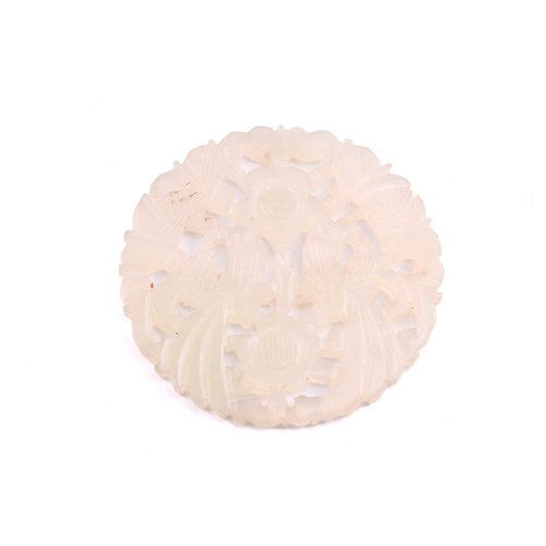 114 - A large Chinese brooch and two Chinese carved jade pendants; The brooch has a carved jade panel of t... 