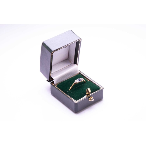 116 - A diamond and sapphire ring, comprises a round sapphire in the centre, flanked by single-cut diamond... 