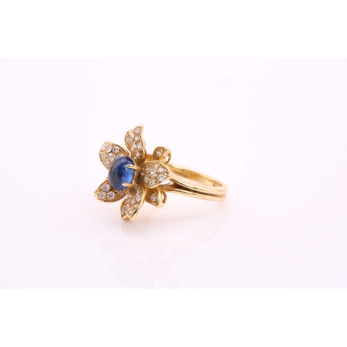 118 - An 18ct gold sapphire and diamond flower ring, comprises an oval sapphire cabochon with a high dome,... 