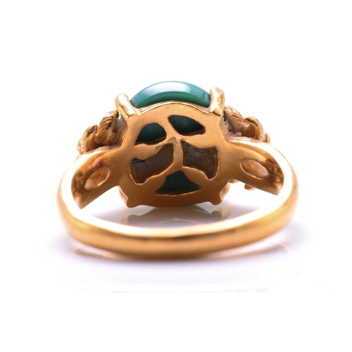 119 - A turquoise dress ring, featuring an oval turquoise cabochon approximately measures 11.8 x 9.9 mm, c... 