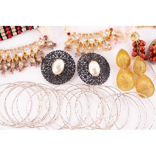 12 - A quantity of costume jewellery, to include examples of an 18ct gold Victorian crescent and star bro... 