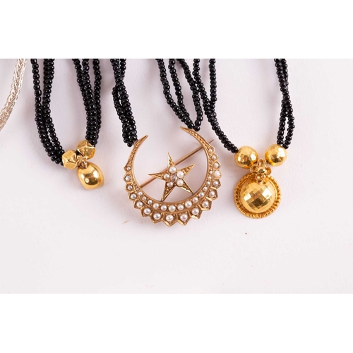 12 - A quantity of costume jewellery, to include examples of an 18ct gold Victorian crescent and star bro... 