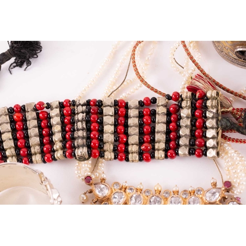 12 - A quantity of costume jewellery, to include examples of an 18ct gold Victorian crescent and star bro... 