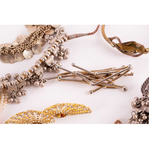 12 - A quantity of costume jewellery, to include examples of an 18ct gold Victorian crescent and star bro... 
