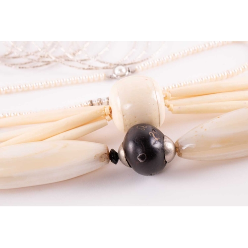 12 - A quantity of costume jewellery, to include examples of an 18ct gold Victorian crescent and star bro... 