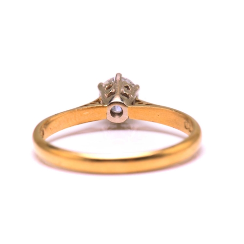 15 - A diamond solitaire ring in 18ct bi-coloured gold, featuring a round brilliant diamond with an estim... 