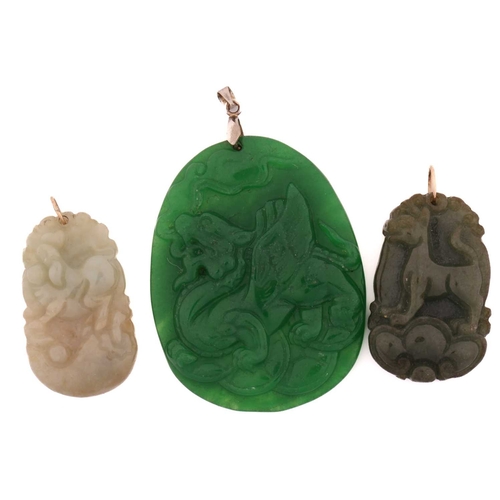 185 - Three modern Chinese carved hardstone pendants; A jadeite pendant of the Chinese zodiac pig on a jum... 