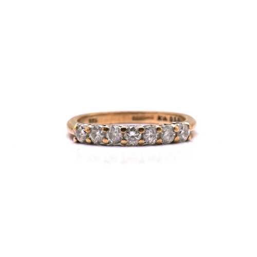 187 - A 9ct gold seven-stone diamond ring, consisting of seven brilliant diamonds with an estimated total ... 