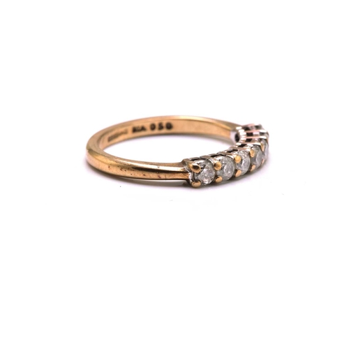 187 - A 9ct gold seven-stone diamond ring, consisting of seven brilliant diamonds with an estimated total ... 