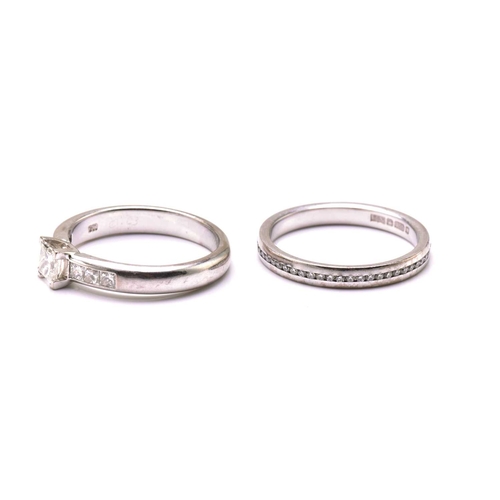 206 - A diamond engagement ring and an eternity ring in 18ct gold, the engagement ring features a princess... 