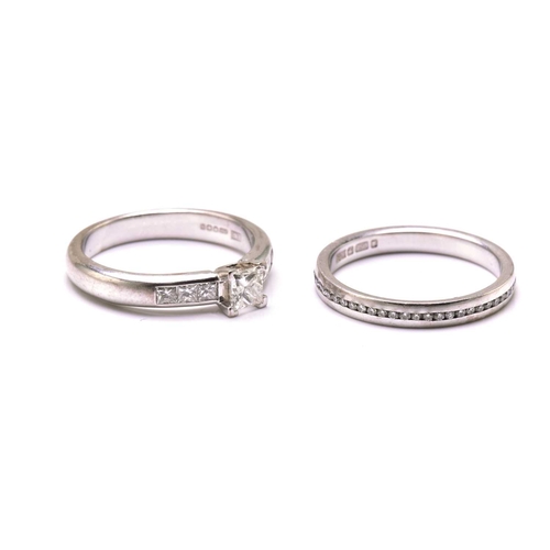 206 - A diamond engagement ring and an eternity ring in 18ct gold, the engagement ring features a princess... 