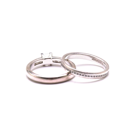206 - A diamond engagement ring and an eternity ring in 18ct gold, the engagement ring features a princess... 