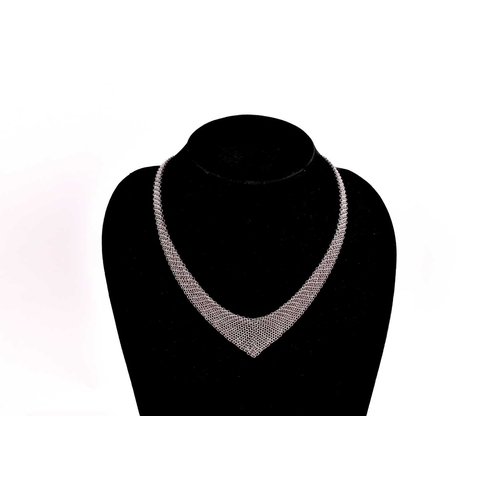 209 - Tiffany & Co. - A silver mesh bib necklace with tie ends, designed by Elsa Peretti, signed by T&Co. ... 