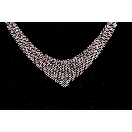 209 - Tiffany & Co. - A silver mesh bib necklace with tie ends, designed by Elsa Peretti, signed by T&Co. ... 