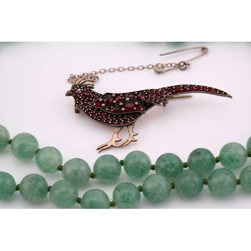 26 - A lot consisting of miscellaneous jewellery items, two domed Turkman style scarf rings in yellow met... 