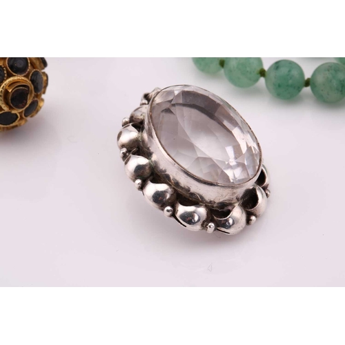 26 - A lot consisting of miscellaneous jewellery items, two domed Turkman style scarf rings in yellow met... 