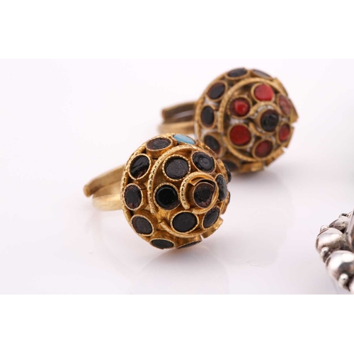26 - A lot consisting of miscellaneous jewellery items, two domed Turkman style scarf rings in yellow met... 