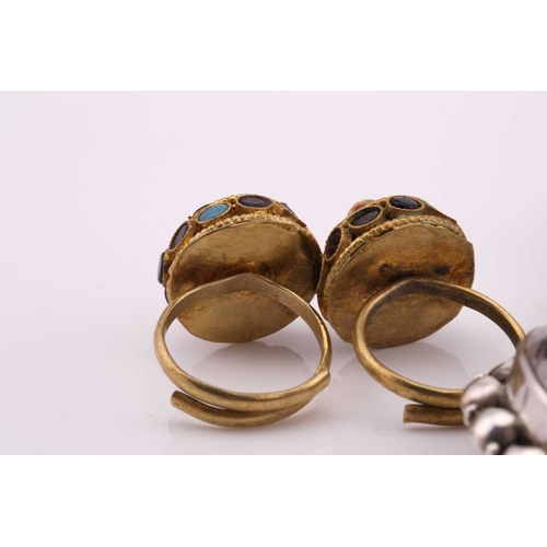 26 - A lot consisting of miscellaneous jewellery items, two domed Turkman style scarf rings in yellow met... 