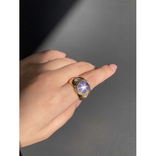 48 - A star sapphire and cubic zirconia gypsy ring, consisting of a pale blue star sapphire approximately... 