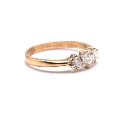 55 - A 9ct gold and three-stone diamond ring, consisting of three brilliant diamonds with an estimated to... 
