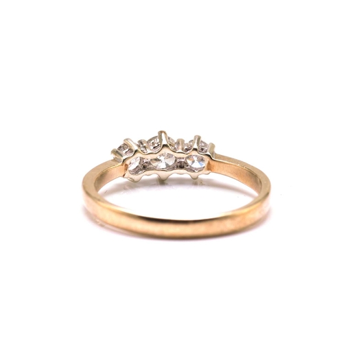 55 - A 9ct gold and three-stone diamond ring, consisting of three brilliant diamonds with an estimated to... 