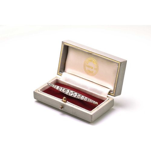 6 - A Victorian diamond bar brooch navette shaped and set with twenty one old brilliant cut diamonds gra... 