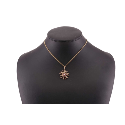 65 - Two gem-set pendants on chain; to include a floral pendant with seed pearls and rubellite accents, o... 