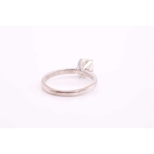 80 - A single stone diamond ring, the round brilliant cut diamond in simple raised claw mount; to taperin... 