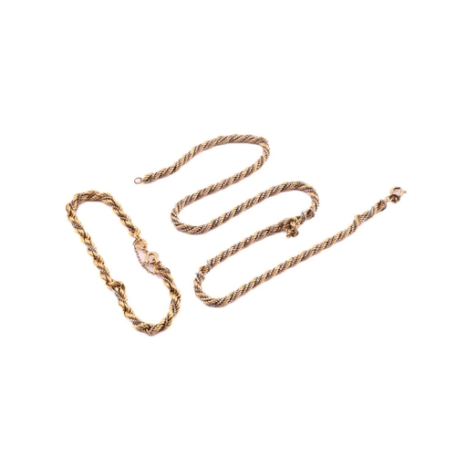 82 - A two-toned twisted necklace and matching bracelet; The necklace consists of a 9ct gold rope chain t... 
