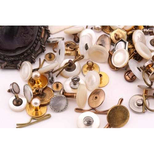 85 - A moulded glass cameo style brooch; the purple frosted glass bust portrait of a woman with ringlets ... 