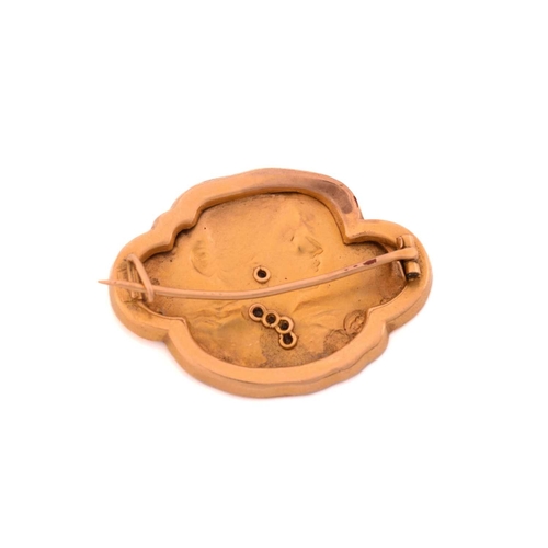 87 - A French Art Nouveau habillé portrait brooch, repoussé depicting a side profile of a lady, with gems... 