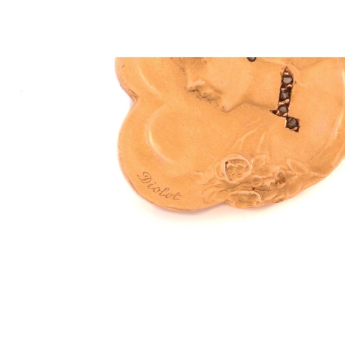 87 - A French Art Nouveau habillé portrait brooch, repoussé depicting a side profile of a lady, with gems... 