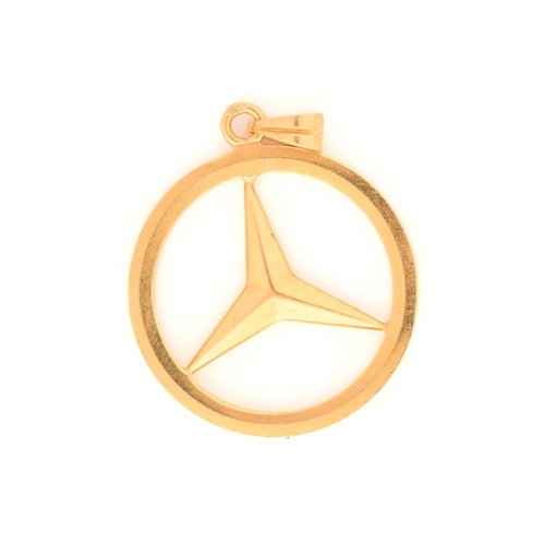 88 - A Mercedes-Benz logo pendant, featuring the iconic three-point star in a ring, attached to a plain b... 