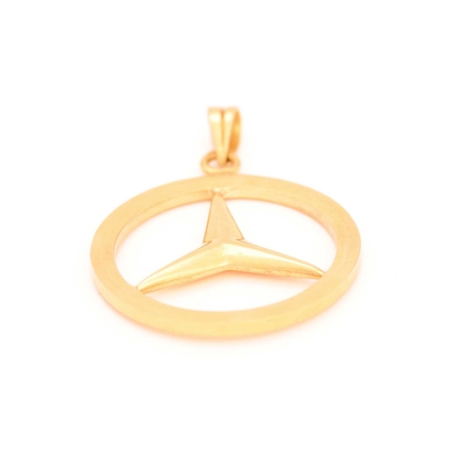 88 - A Mercedes-Benz logo pendant, featuring the iconic three-point star in a ring, attached to a plain b... 