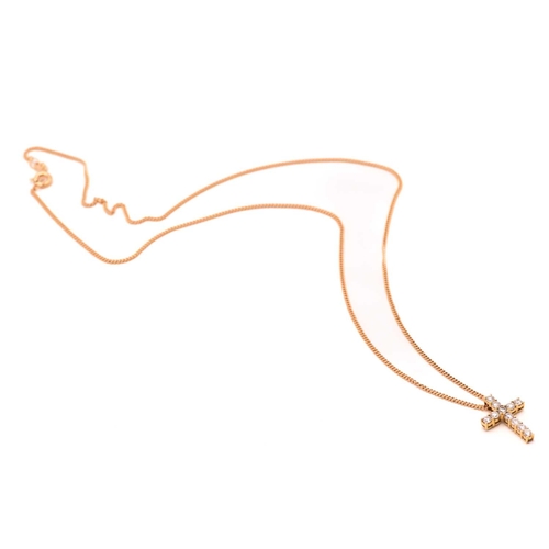 89 - An 18ct gold and diamond-set cross pendant on chain, consisting of eleven brilliant diamonds with an... 