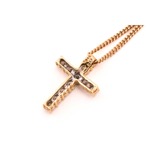 89 - An 18ct gold and diamond-set cross pendant on chain, consisting of eleven brilliant diamonds with an... 