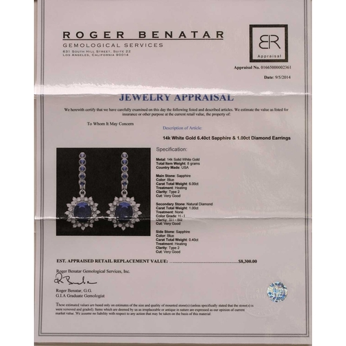 92 - A pair of sapphire and diamond drop earrings, each comprising an oval faceted sapphire with dark blu... 