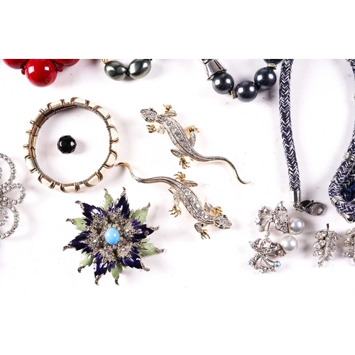 246 - A mixed collection of costume jewellery including necklaces, bangles, clip-on earrings and various b... 