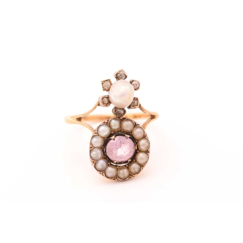 258 - An Edwardian pink topaz and pearl dress ring, featuring an oval-cut pale pink topaz approximately me... 