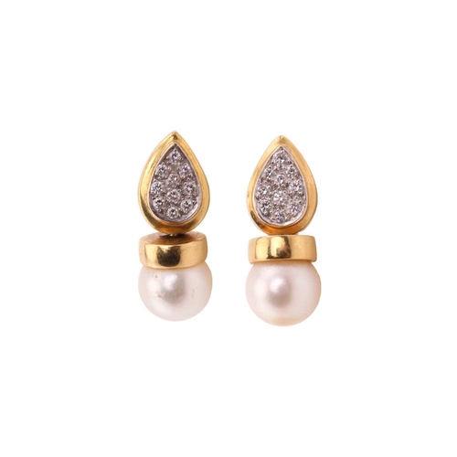 259 - A pair of pearl and diamond earrings, each consisting of an 8.5 mm cream coloured pearl with pink ov... 