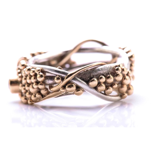 261 - A 9ct bi-coloured gold cocktail ring with pink sapphire and aquamarine highlights, on a twisted wire... 