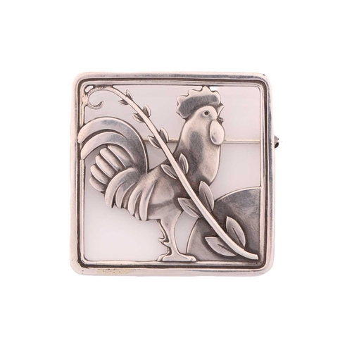 264 - Georg Jensen - A cockerel brooch, depicting a cockerel with fern accent in a square frame, with hing... 