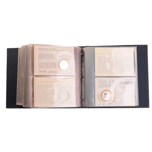 275 - International Society of Postmasters commemorative album, 1975-1977, thirty six First Day Covers eac... 