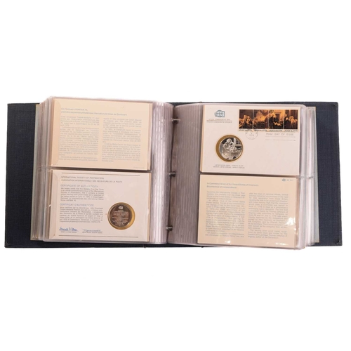 275 - International Society of Postmasters commemorative album, 1975-1977, thirty six First Day Covers eac... 
