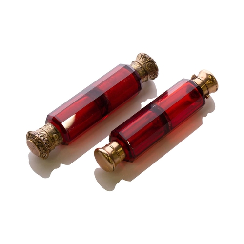 288 - Two Victorian ruby glass double-ended scent bottles; the first has gilt floral terminations, engrave... 