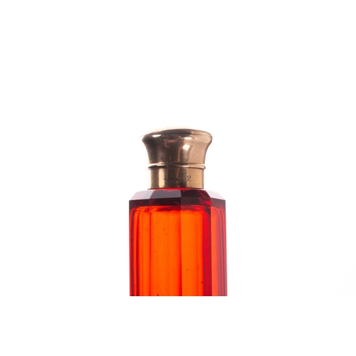 288 - Two Victorian ruby glass double-ended scent bottles; the first has gilt floral terminations, engrave... 