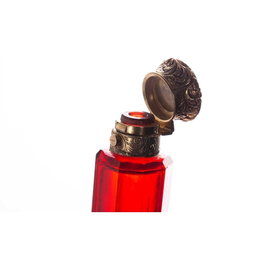 288 - Two Victorian ruby glass double-ended scent bottles; the first has gilt floral terminations, engrave... 