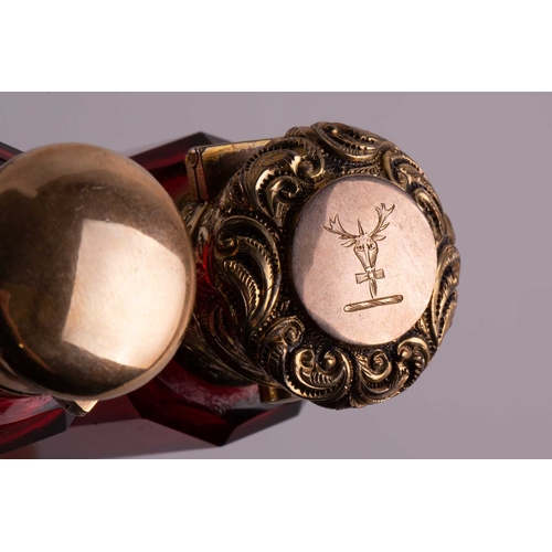 288 - Two Victorian ruby glass double-ended scent bottles; the first has gilt floral terminations, engrave... 